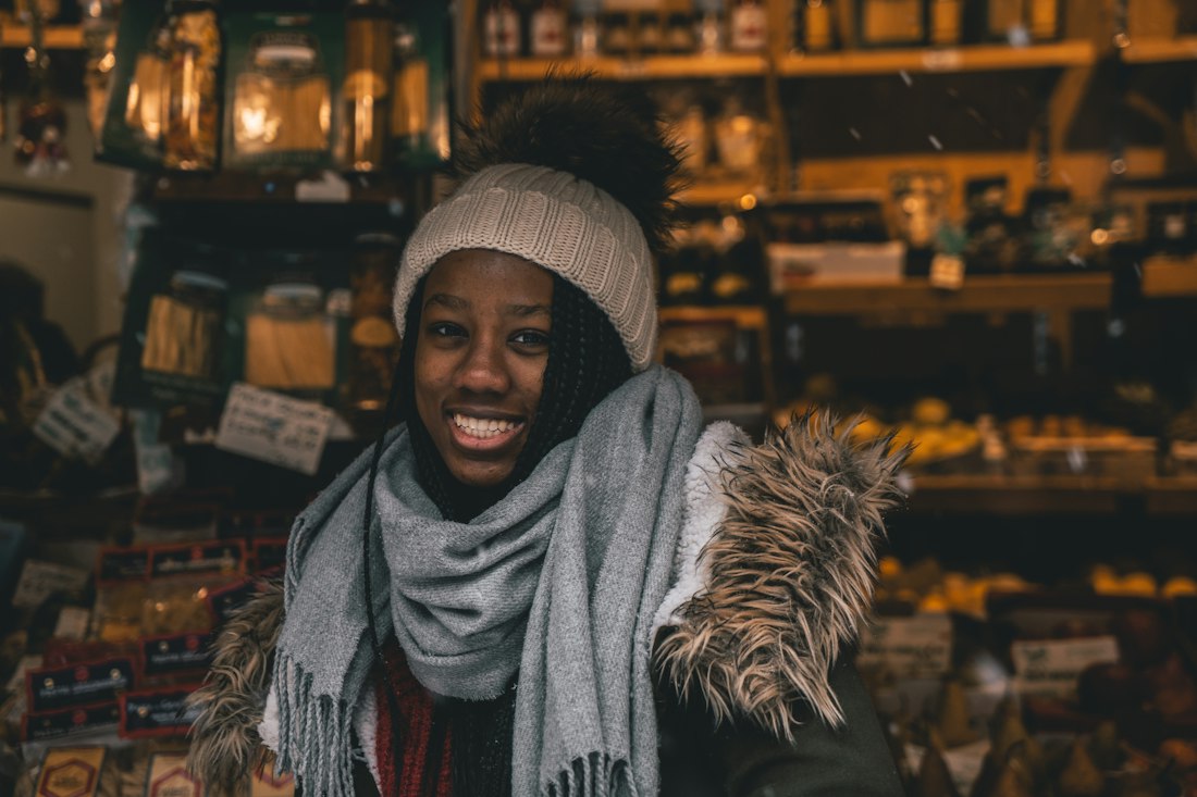 A smiling woman in a cozy shop